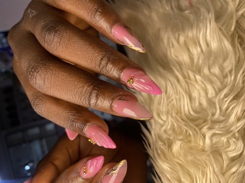 Nail technician working on a client